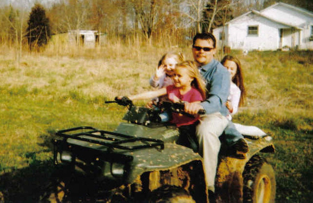 jeremys brother and 3 neices on his 4 wheeler